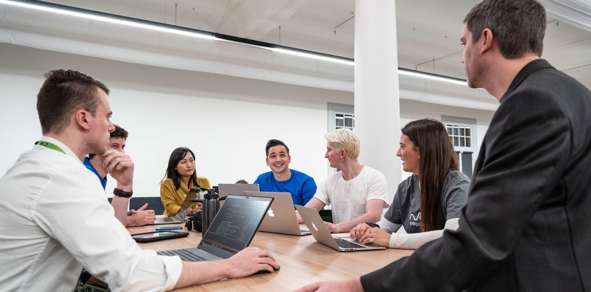 Chamonix graduates sat around a desk in the main office at Lot Fourteen.